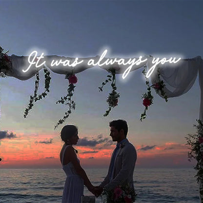 It Was Always You neon sign mounted on the wedding space